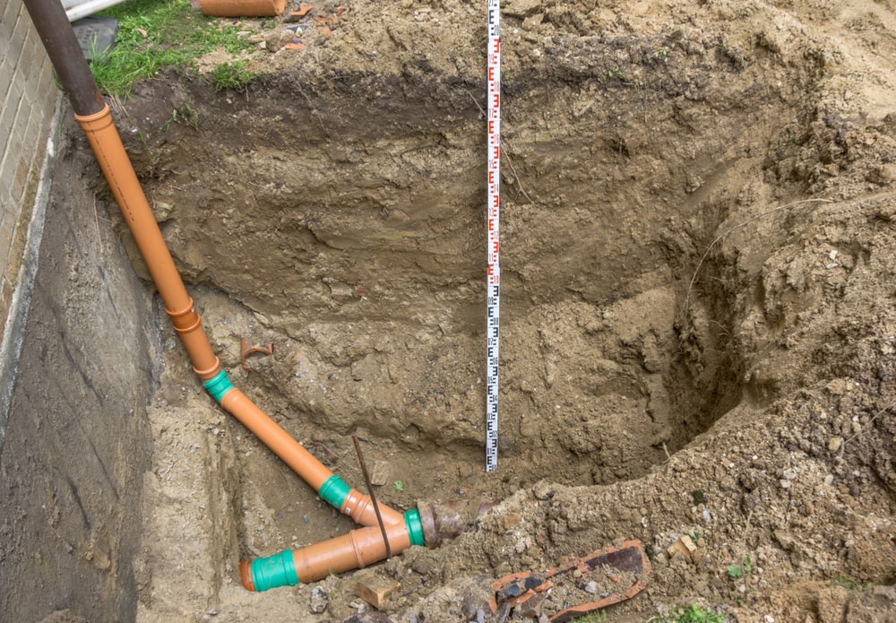 sewer line being replaced after a section has a belly in it